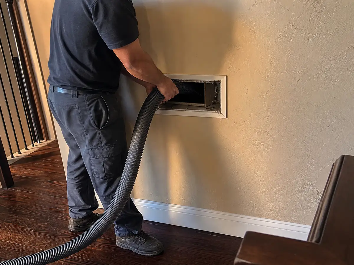 air duct cleaning technician on the job in El Dorado Hills, CA